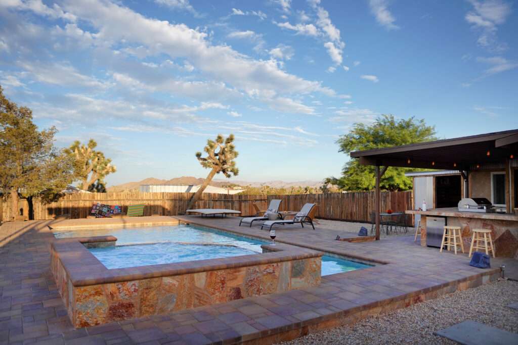 With views of Joshua Trees and Yucca Valley, The Flutter Experience private patio and pool are the ideal location for a retreat